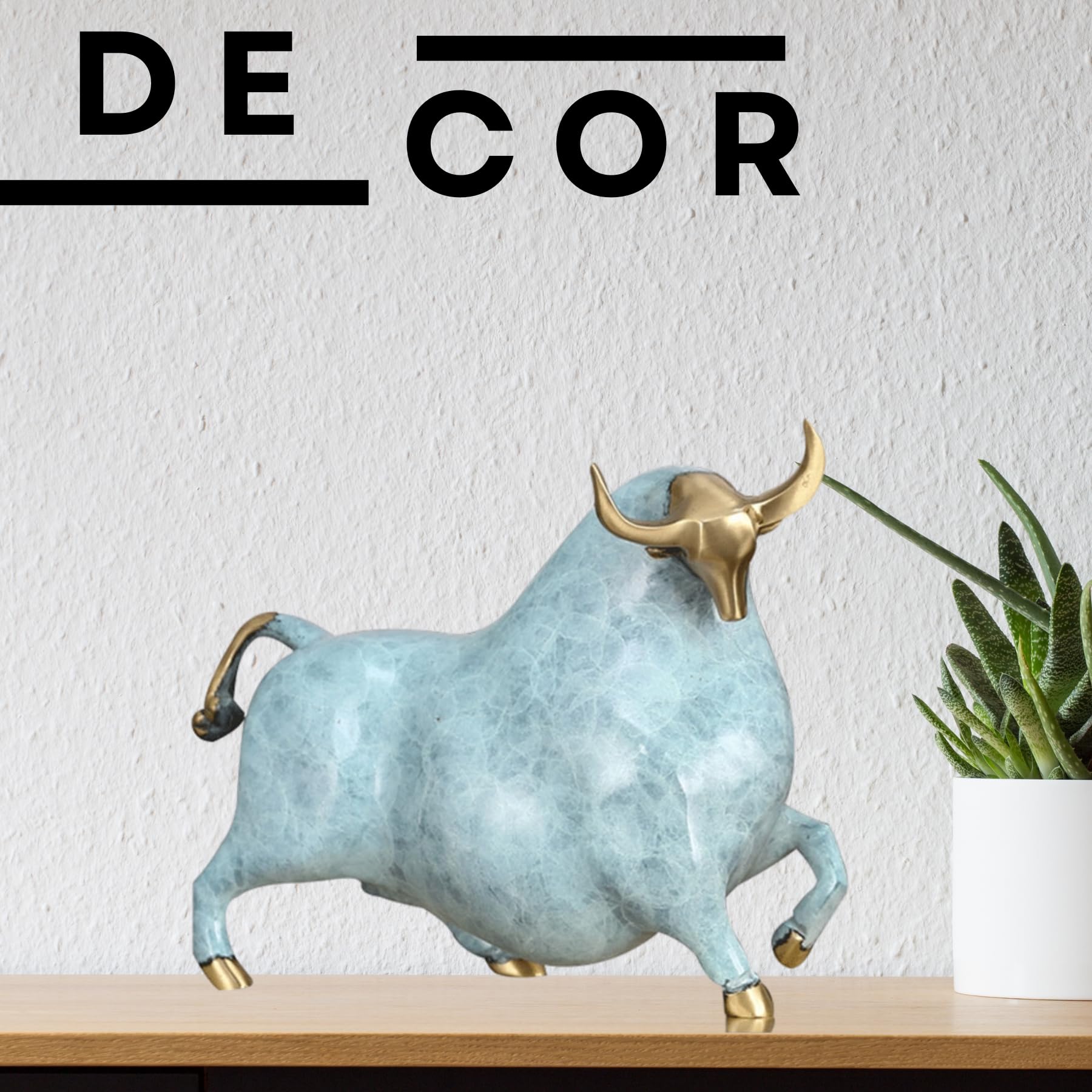 Close-up of the sky blue bull head with polished brass horn details.