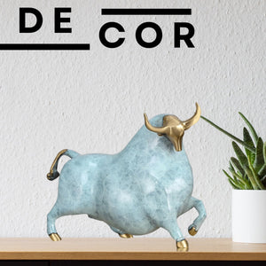 Close-up of the sky blue bull head with polished brass horn details.