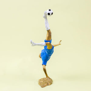 Rear action view of gold jersey Messi-inspired bicycle kick football legend figurine