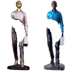 Side profile showing the iconic hollowed-out surrealist design of the statue