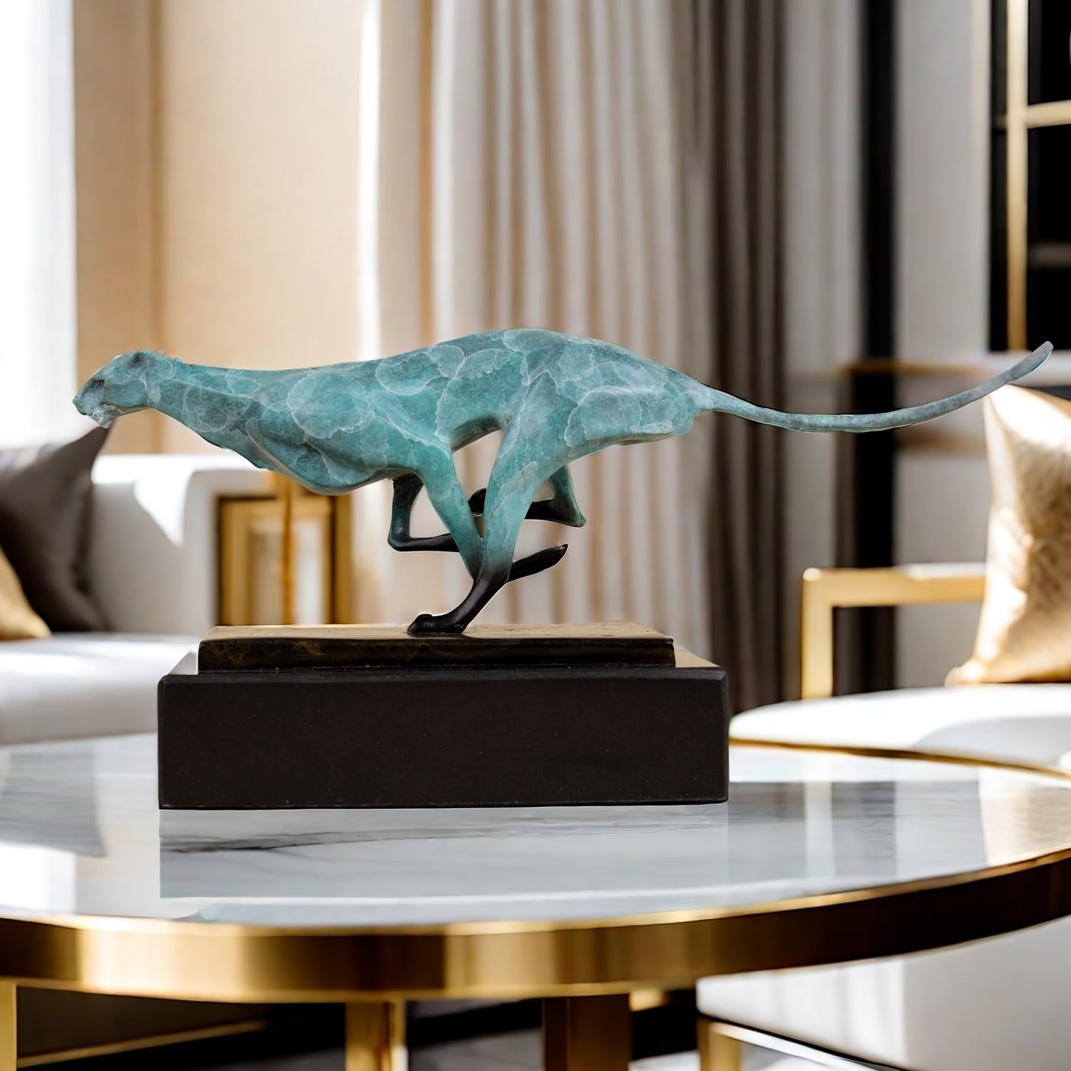 Teal azure running cheetah sculpture on black marble base displayed on gold side table in luxury interior