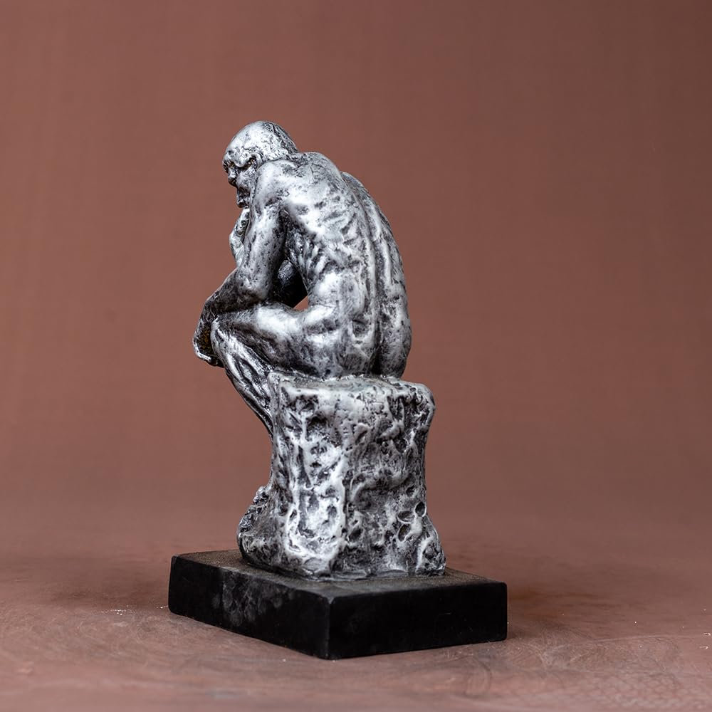 The Thinker gothic silver bronze statue left side view displaying contemplative pose and rock detail