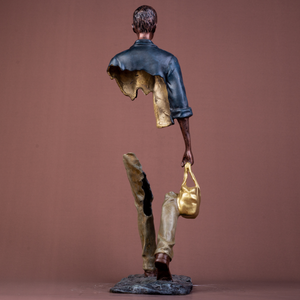 Back view of the 6.6kg solid bronze traveler sculpture with navy blue patina.