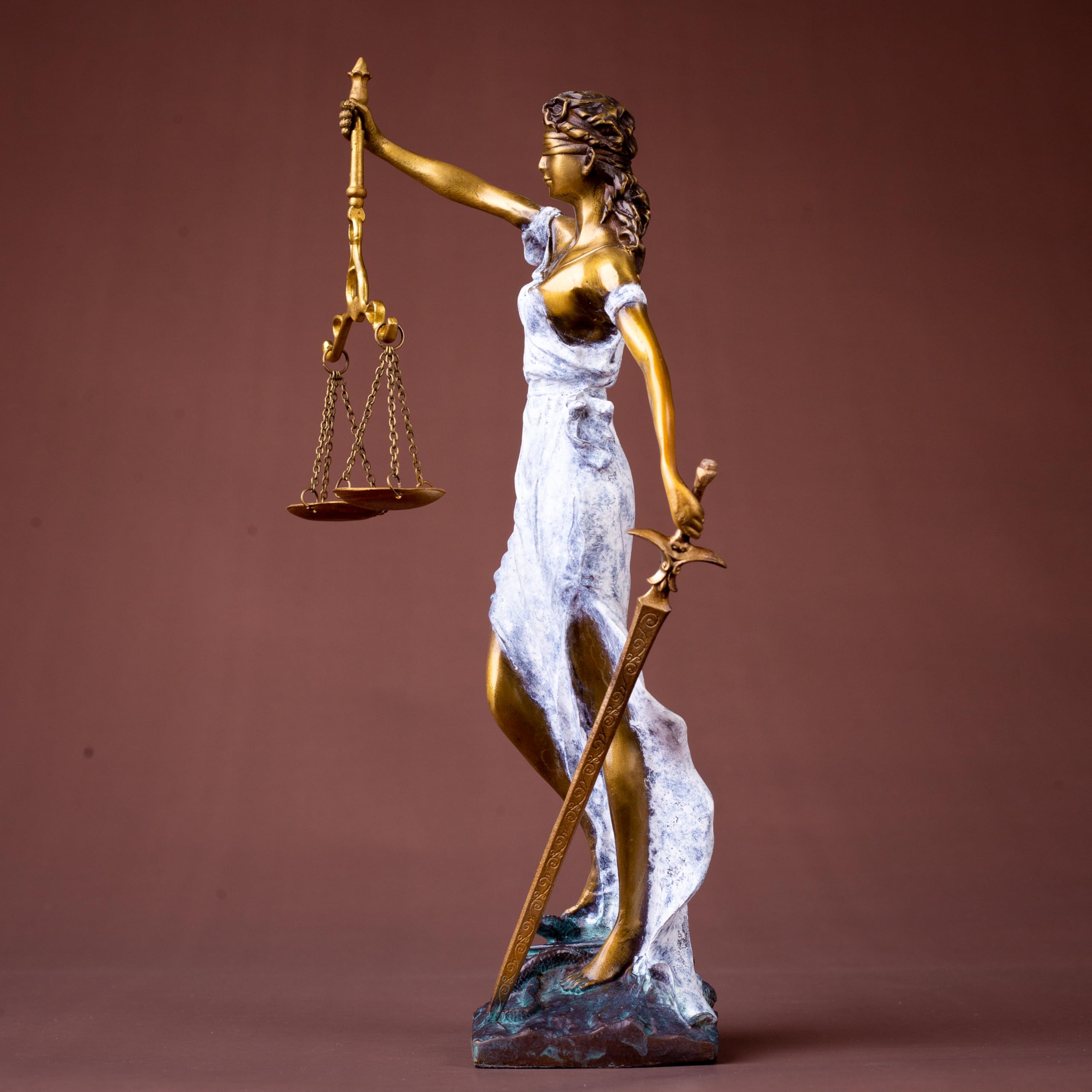 White finish Lady Justice Themis statue front full body view on warm brown background