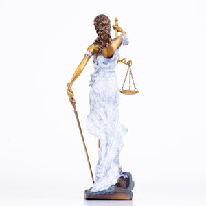 white Lady Justice Themis statue full body side view on warm brown background