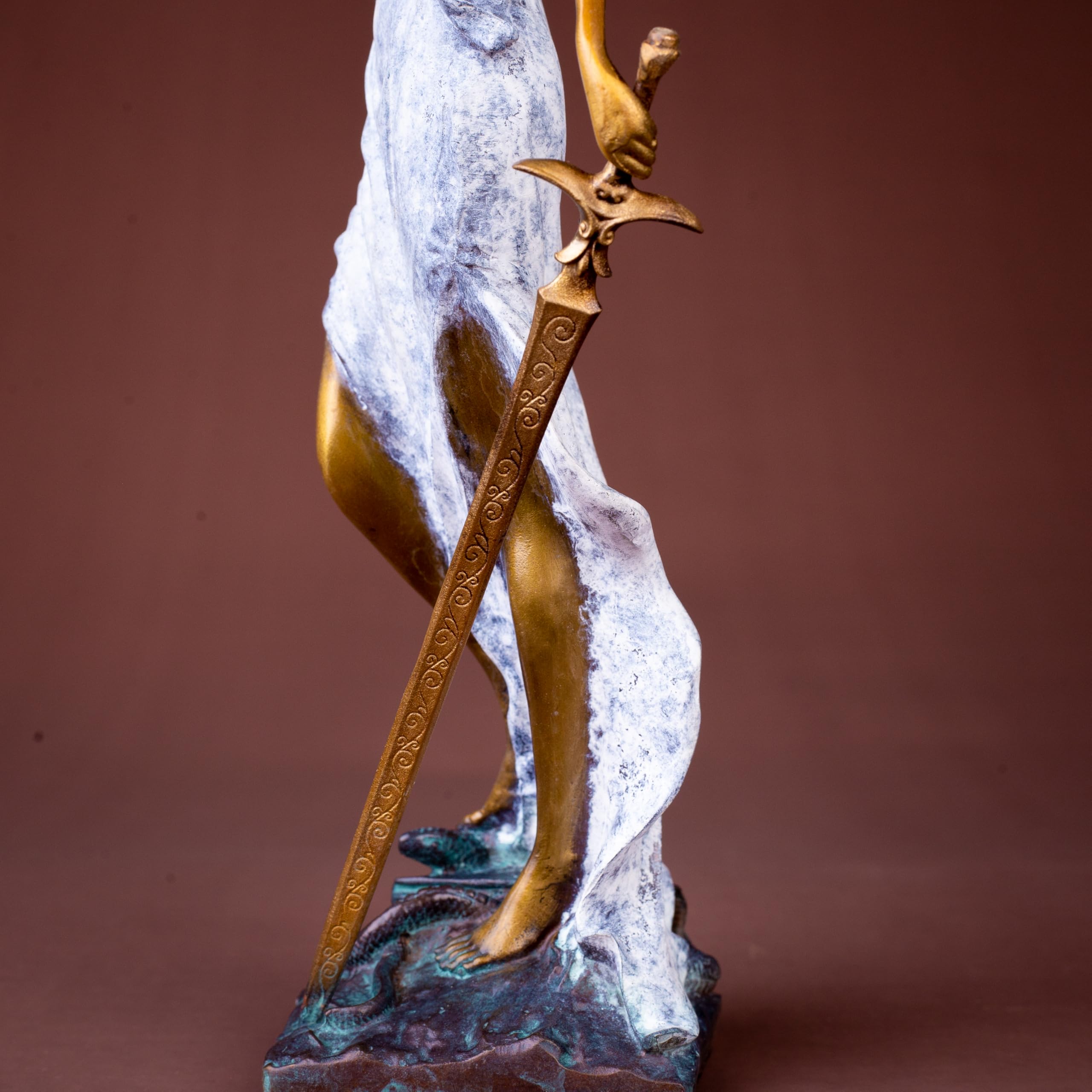 White finish Lady Justice Themis statue front full body view on warm brown background