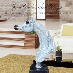 White patina bronze Arabian horse head sculpture displayed near staircase in modern hallway interior
