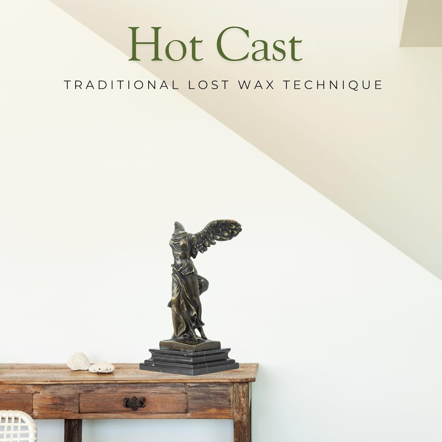 Winged Victory of Samothrace bronze statue displayed as home décor on shelf with art prints