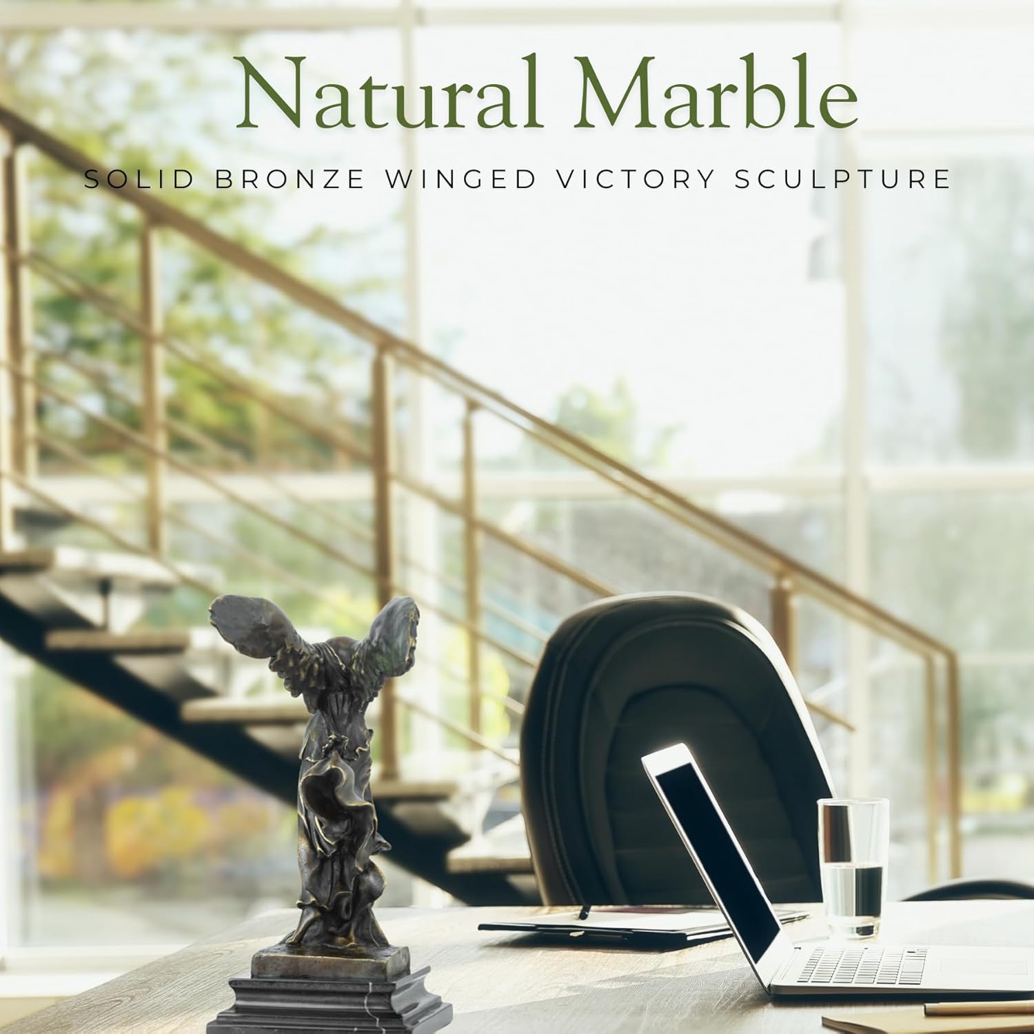 Winged Victory Nike bronze statue on natural marble base in luxury office interior setting