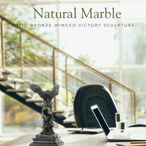 Winged Victory Nike bronze statue on natural marble base in luxury office interior setting