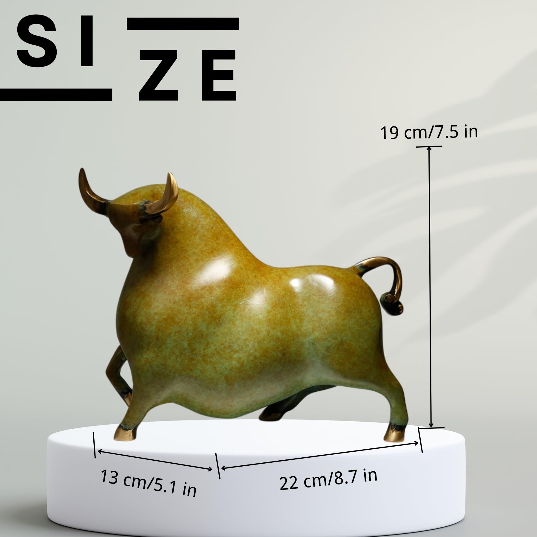 Side profile of the artistic yellowish-green charging bull figurine.